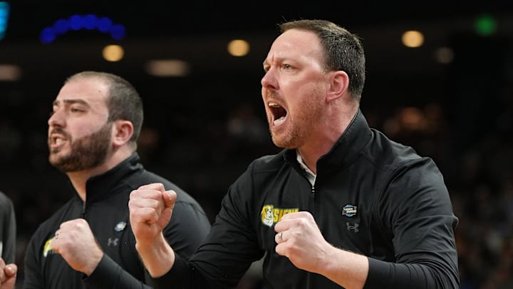 Mar 19, 2026; Greenville, SC, USA; Siena Saints head coach Gerry McNamara reacts in the first half during a first round game of the men's 2026 NCAA Tournament at Bon Secours Wellness Arena. Mandatory Credit: Bob Donnan-Imagn Images
