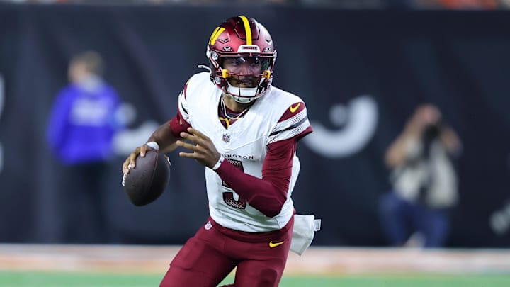 Sep 23, 2024; Cincinnati, Ohio, USA; Washington Commanders quarterback Jayden Daniels (5) runs during the fourth quarter against the Cincinnati Bengals at Paycor Stadium. Mandatory Credit: Joseph Maiorana-Imagn Images Sep 23, 2024; Cincinnati, Ohio, USA; Washington Commanders quarterback Jayden Daniels (5) runs during the fourth quarter against the Cincinnati Bengals at Paycor Stadium. Mandatory Credit: Joseph Maiorana-Imagn Images