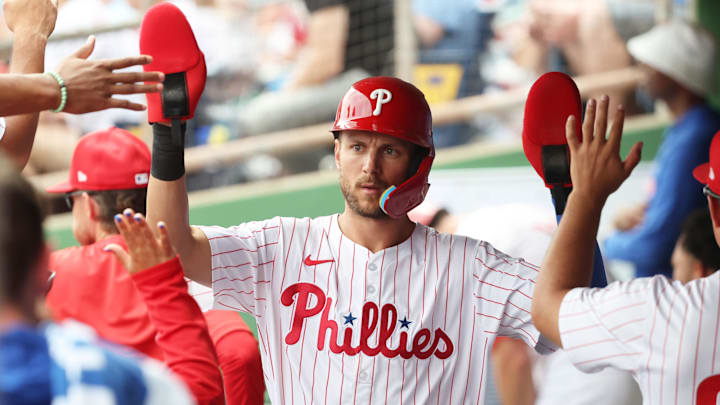 Mar 24, 2025; Clearwater, Florida, USA; Philadelphia Phillies shortstop Trea Turner (7) is congratulated after he scored a run during the first inning against the Tampa Bay Rays at BayCare Ballpark Mar 24, 2025; Clearwater, Florida, USA; Philadelphia Phillies shortstop Trea Turner (7) is congratulated after he scored a run during the first inning against the Tampa Bay Rays at BayCare Ballpark