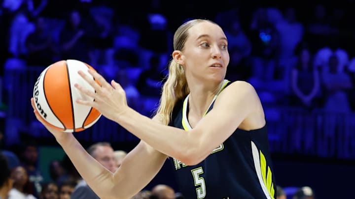 Dallas Wings guard Paige Bueckers looks to pass against the Seattle Storm.