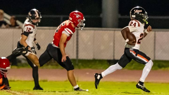 Oviedo High's Johnnie Rollins (24) breaks loose for a big gain during the Lions' 61-13 victory against East River on Sept. 25, 2026. He rushed five times for 129 yards and two touchdowns. Oviedo High's Johnnie Rollins (24) breaks loose for a big gain during the Lions' 61-13 victory against East River on Sept. 25, 2026. He rushed five times for 129 yards and two touchdowns.