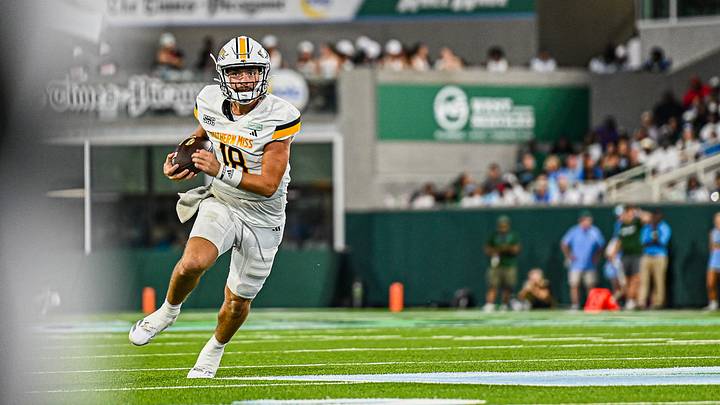 Southern Miss quarterback Landry Lyddy scrambles for a first down against Tulane.