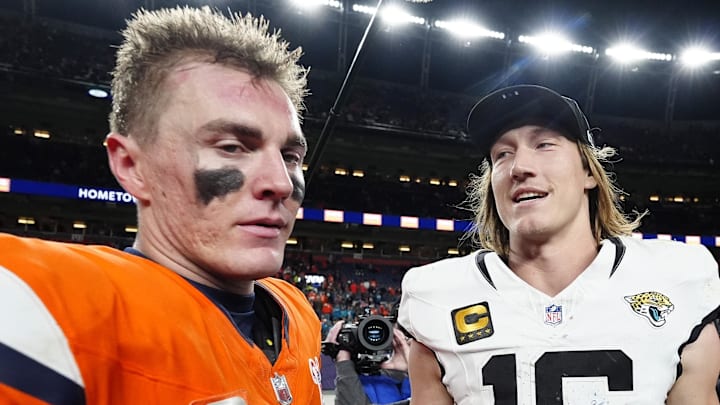 Dec 21, 2025; Denver, Colorado, USA; Denver Broncos quarterback Bo Nix (10) and Jacksonville Jaguars quarterback Trevor Lawrence (16) meet after the game at Empower Field at Mile High. Mandatory Credit: Ron Chenoy-Imagn Images