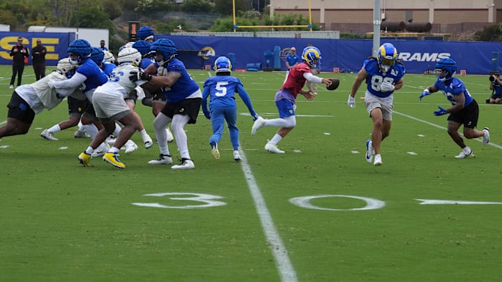 May 28, 2025; Woodland Hills, CA, USA; A general overall view as Los Angeles Rams quarterback Matthew Stafford (9) hands the ball off to running back Kyren Williams (23) during organized team activities at Rams Practice Facility. Mandatory Credit: Kirby Lee-Imagn Images