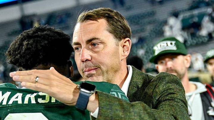 Michigan State's Athletic Director J Batt, right, hugs Nick Marsh after the Spartans win over Western Michigan on Friday, Aug. 29, 2025, in East Lansing.
