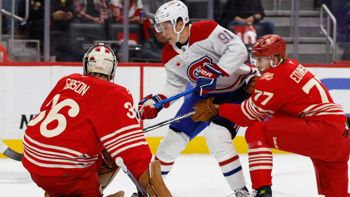 Oct 9, 2025; Detroit, Michigan, USA;  Detroit Red Wings goaltender John Gibson (36) makes the save on Montréal Canadiens center Oliver Kapanen (91) in the first period at Little Caesars Arena. Mandatory Credit: Rick Osentoski-Imagn Images