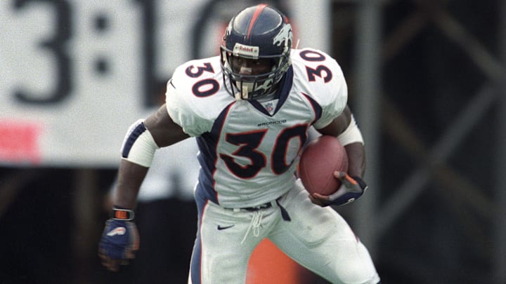 Nov 1, 1998; Cincinnati, OH, USA; FILE PHOTO; Denver Broncos running back Terrell Davis (30) runs with the ball against the Cincinnati Bengals at Riverfront Stadium. The Broncos beat the Bengals 33-26. 