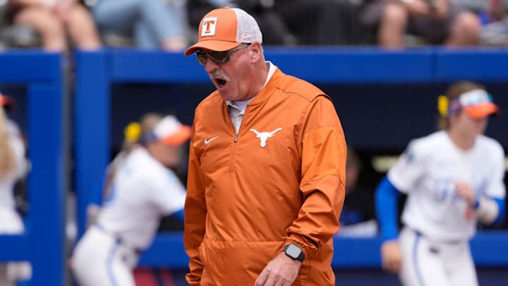 Texas Longhorns head coach Mike White shouts during a Women's College World Series softball game.