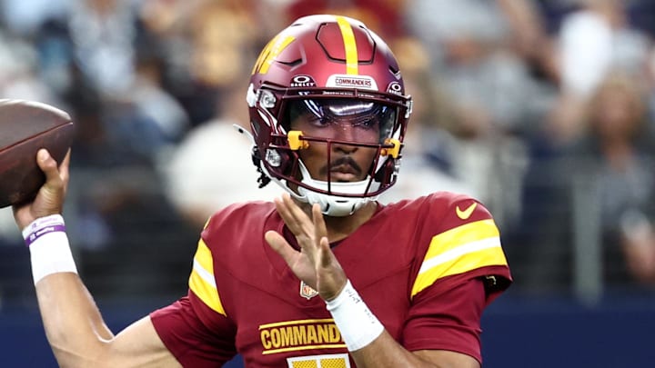 Oct 19, 2025; Arlington, Texas, USA; Washington Commanders quarterback Jayden Daniels (5) passes the ball against the Dallas Cowboys during the first quarter of the game at AT&T Stadium. Mandatory Credit: Kevin Jairaj-Imagn Images