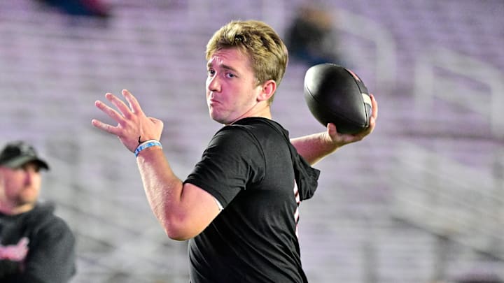 Oct 25, 2024; Chestnut Hill, Massachusetts, USA; Louisville Cardinals quarterback Harrison Bailey (15) warms up before a game against the Boston College Eagles at Alumni Stadium.