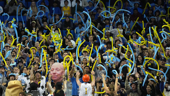Nov 7, 2022; Los Angeles, California, USA; UCLA Bruins fans hold a cutout of coach Mick Cronin during the game against the Sacramento State Hornets  at Pauley Pavilion. Mandatory Credit: Kirby Lee-Imagn Images