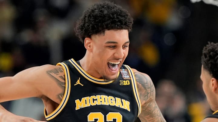 Michigan forward Yaxel Lendeborg (23) celebrates a play with Michigan guard Trey McKenney (1) in the first half of their Final Four game at Lucas Oil Stadium in Indianapolis on Saturday, April 4, 2026.