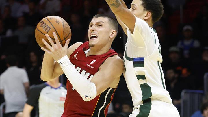 Nov 26, 2025; Miami, Florida, USA; Milwaukee Bucks guard Ryan Rollins (13) defends against Miami Heat guard Tyler Herro (14) during the second half of an NBA Cup game at Kaseya Center. Mandatory Credit: Rhona Wise-Imagn Images