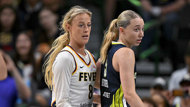 Aug 1, 2025; Dallas, Texas, USA; Dallas Wings guard Paige Bueckers (5) and Indiana Fever guard Sophie Cunningham (8) in action during the game between the Dallas Wings and the Indiana Fever at the American Airlines Center. Mandatory Credit: Jerome Miron-Imagn Images