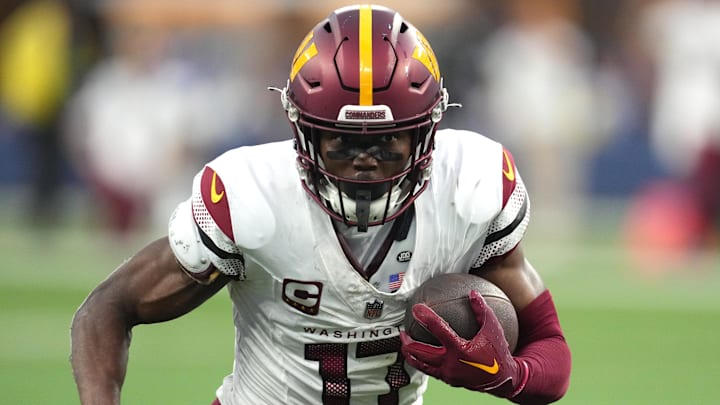 Dec 17, 2023; Inglewood, California, USA; Washington Commanders wide receiver Terry McLaurin (17) carries the ball against the Los Angeles Rams in the second half at SoFi Stadium. Mandatory Credit: Kirby Lee-Imagn Images