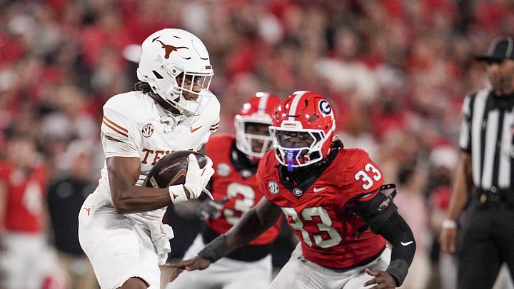 Texas Longhorns wide receiver Ryan Wingo runs the ball against Georgia Bulldogs linebacker Quintavius Johnson.