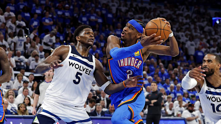 May 28, 2025; Oklahoma City, Oklahoma, USA; Oklahoma City Thunder guard Shai Gilgeous-Alexander (2) drives to the basket against Minnesota Timberwolves guard Anthony Edwards (5) and guard Mike Conley (10) during the fourth quarter in game five of the western conference finals for the 2025 NBA Playoffs at Paycom Center. Mandatory Credit: Alonzo Adams-Imagn Images May 28, 2025; Oklahoma City, Oklahoma, USA; Oklahoma City Thunder guard Shai Gilgeous-Alexander (2) drives to the basket against Minnesota Timberwolves guard Anthony Edwards (5) and guard Mike Conley (10) during the fourth quarter in game five of the western conference finals for the 2025 NBA Playoffs at Paycom Center. Mandatory Credit: Alonzo Adams-Imagn Images