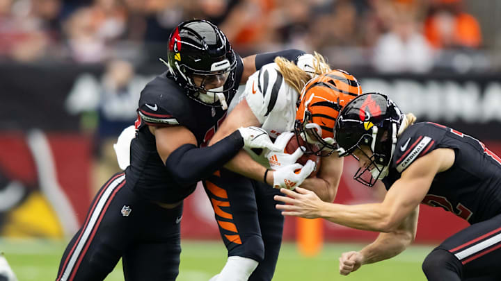 Oct 8, 2023; Glendale, Arizona, USA; Arizona Cardinals linebacker Ezekiel Turner (47) and punter Blake Gillikin (12) tackle Cincinnati Bengals wide receiver Trenton Irwin (16) at State Farm Stadium. Mandatory Credit: Mark J. Rebilas-Imagn Images