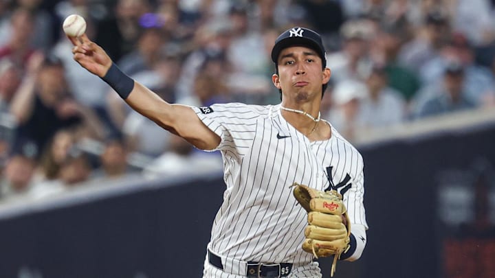 May 2, 2025; Bronx, New York, USA; New York Yankees third baseman Oswaldo Cabrera (95) throws the ball to first base for an out during the fourth inning against the Tampa Bay Rays at Yankee Stadium. Mandatory Credit: Vincent Carchietta-Imagn Images