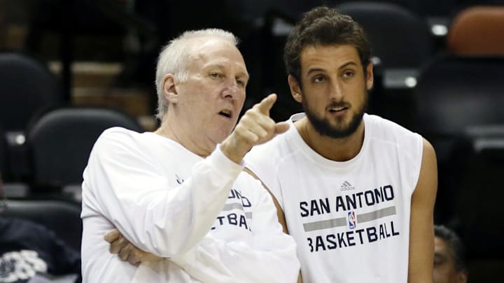 Nov 20, 2013; San Antonio, TX, USA; San Antonio Spurs head coach Gregg Popovich chats with forward Marco Belinelli (right) before the game against the Boston Celtics at AT&T Center. Mandatory Credit: Soobum Im-Imagn Images