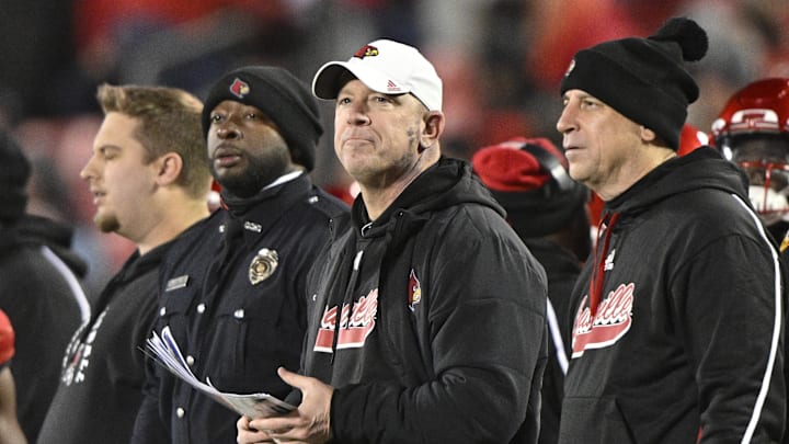 Nov 23, 2024; Louisville, Kentucky, USA; Louisville Cardinals head coach Jeff Brohm looks toward the scoreboard during the second half against the Pittsburgh Panthers at L&N Federal Credit Union Stadium. Louisville defeated Pittsburgh 37-9. Mandatory Credit: Jamie Rhodes-Imagn Images Nov 23, 2024; Louisville, Kentucky, USA; Louisville Cardinals head coach Jeff Brohm looks toward the scoreboard during the second half against the Pittsburgh Panthers at L&N Federal Credit Union Stadium. Louisville defeated Pittsburgh 37-9. Mandatory Credit: Jamie Rhodes-Imagn Images