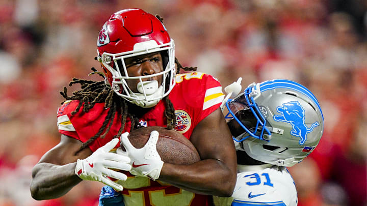 Kansas City Chiefs running back Kareem Hunt (29) is tackled by Detroit Lions safety Kerby Joseph (31) 