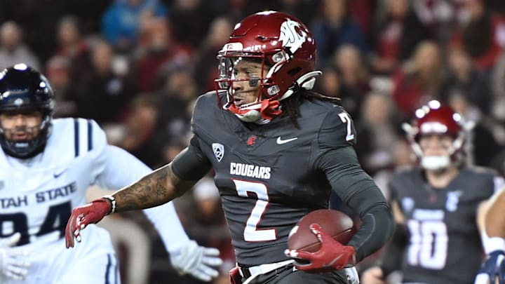 Nov 9, 2024; Pullman, Washington, USA; Washington State Cougars wide receiver Kyle Williams (2) runs the ball against the Utah State Aggies in the first half at Gesa Field at Martin Stadium. Mandatory Credit: James Snook-Imagn Images