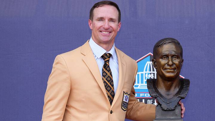 Aug 8, 2026; Canton, OH, USA; Pro Football Hall of Fame enshrinee Drew Brees poses with his bust during the Class of 2026 enshrinement ceremony at Tom Benson Hall of Fame Stadium. Aug 8, 2026; Canton, OH, USA; Pro Football Hall of Fame enshrinee Drew Brees poses with his bust during the Class of 2026 enshrinement ceremony at Tom Benson Hall of Fame Stadium.