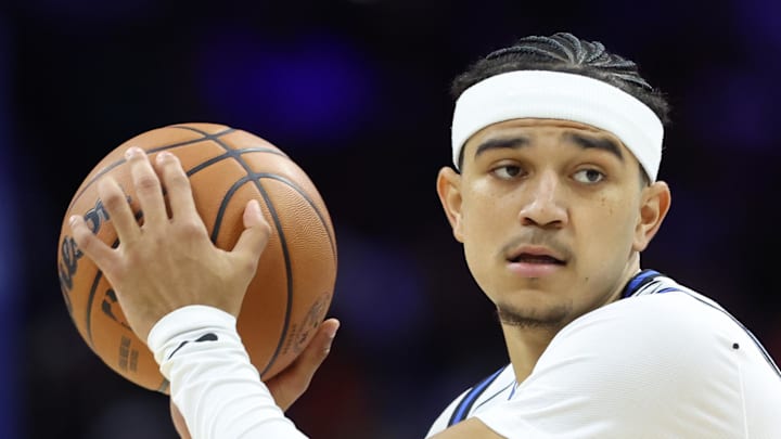 Orlando Magic guard Anthony Black controls the ball against Philadelphia 76ers forward Justin Edwards. Orlando Magic guard Anthony Black controls the ball against Philadelphia 76ers forward Justin Edwards.