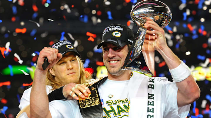 Green Bay Packers quarterback Aaron Rodgers (right) smiles with linebacker Clay Matthews (left) after winning Super Bowl XLV.
