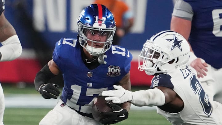 Sep 26, 2024; East Rutherford, New Jersey, USA;  New York Giants wide receiver Wan'Dale Robinson (17) runs past Dallas Cowboys cornerback Jourdan Lewis (2) during the second half at MetLife Stadium. Mandatory Credit: Robert Deutsch-Imagn Images