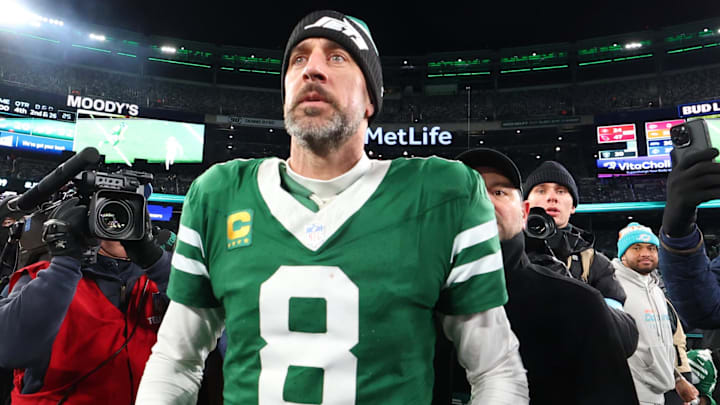 Jan 5, 2025; East Rutherford, New Jersey, USA; New York Jets quarterback Aaron Rodgers (8) walks on the field after the Jets win over the Miami Dolphins at MetLife Stadium. Mandatory Credit: Ed Mulholland-Imagn Images Jan 5, 2025; East Rutherford, New Jersey, USA; New York Jets quarterback Aaron Rodgers (8) walks on the field after the Jets win over the Miami Dolphins at MetLife Stadium. Mandatory Credit: Ed Mulholland-Imagn Images