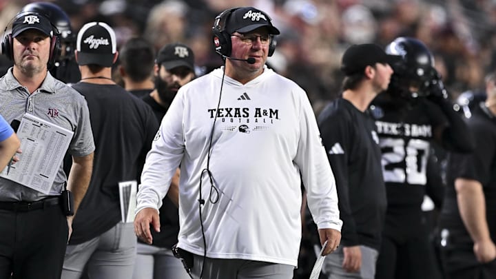 Texas A&M Aggies head coach Mike Elko looks on during the first half against the Mississippi State Bulldogs at Kyle Field. Texas A&M Aggies head coach Mike Elko looks on during the first half against the Mississippi State Bulldogs at Kyle Field.