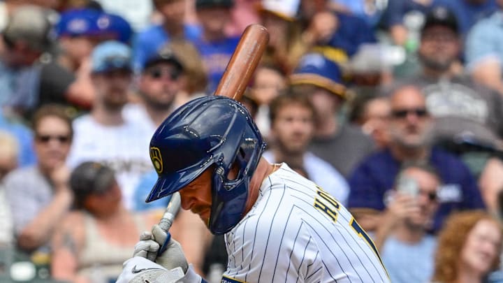 Milwaukee Brewers first baseman Rhys Hoskins (12) is hit by a pitch in the third inning against the Colorado Rockies at American Family Field on June 28. 