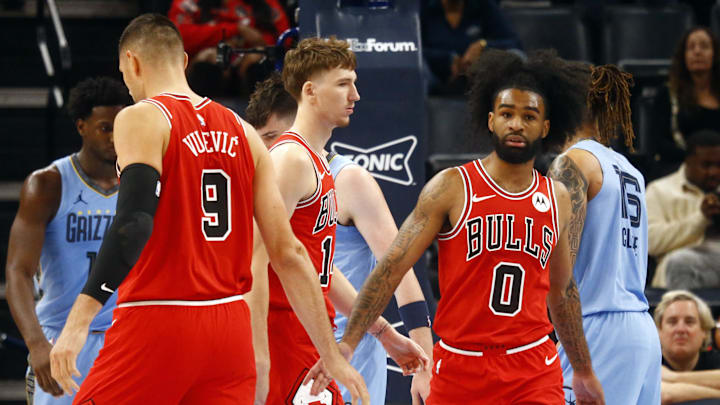 Oct 28, 2024; Memphis, Tennessee, USA; Chicago Bulls guard Coby White (0) reacts with center Nikola Vucevic (9) during the first half against the Memphis Grizzlies at FedExForum. Mandatory Credit: Petre Thomas-Imagn Images