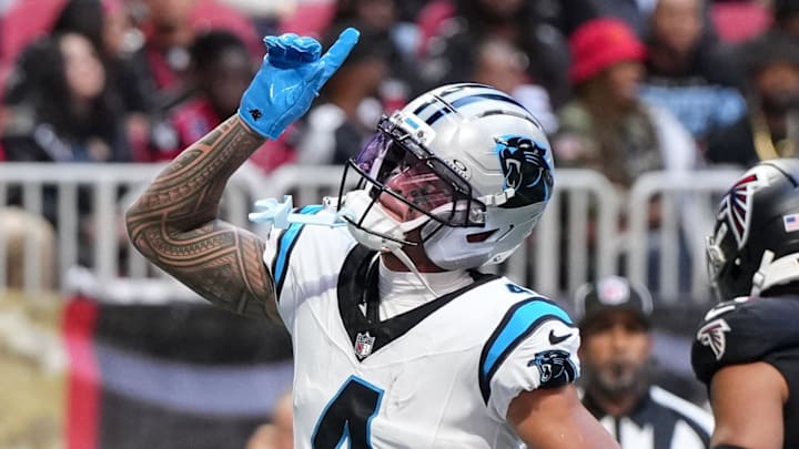 Nov 16, 2025; Atlanta, Georgia, USA; Carolina Panthers wide receiver Tetairoa McMillan (4) celebrates a touchdown in the first quarter against the Atlanta Falcons at Mercedes-Benz Stadium. Mandatory Credit: Dale Zanine-Imagn Images