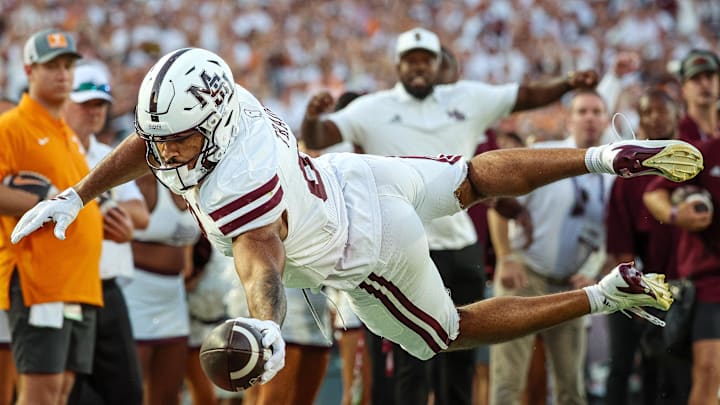 Mississippi State Bulldogs tight end Seydou Traore (8) dives for a touchdown against the Tennessee Volunteers during the second half at Davis Wade Stadium at Scott Field.