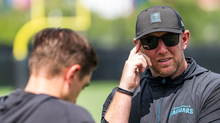 Jacksonville Jaguars general manager James Gladstone, left, talks with Jacksonville Jaguars head coach Liam Coen, right, after the. Jacksonville Jaguars’ mandatory minicamp Tuesday June 10, 2025 at the Miller Electric Center in Jacksonville, Fla. 