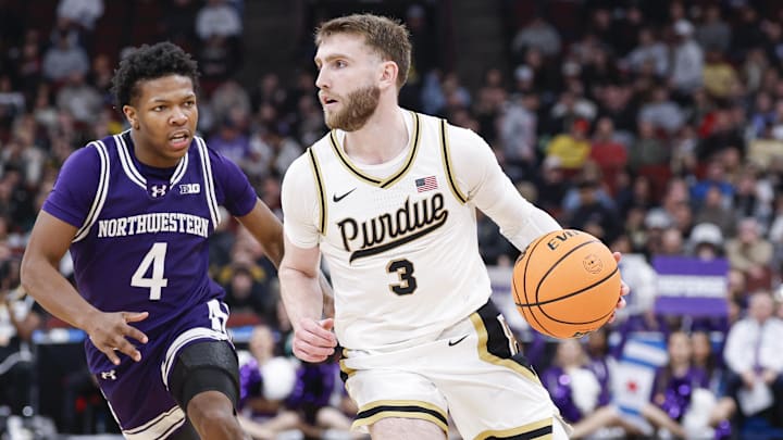 Purdue Boilermakers guard Braden Smith (3) drives to the basket against Northwestern Wildcats guard Jayden Reid (4).
