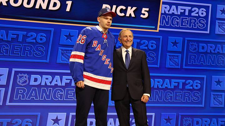 Jun 26, 2026; Buffalo, New York, USA; Alberts Smits reacts beside NHL commissioner Gary Bettman after being selected with the fifth pick in the first round of the 2026 NHL Draft by the New York Rangers at KeyBank Center. 