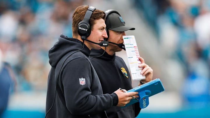 Jan 4, 2026; Jacksonville, Florida, USA; Jacksonville Jaguars offensive coordinator Grant Udinski and head coach Liam Coen during the second quarter against the Tennessee Titans at EverBank Stadium. Mandatory Credit: Morgan Tencza-Imagn Images