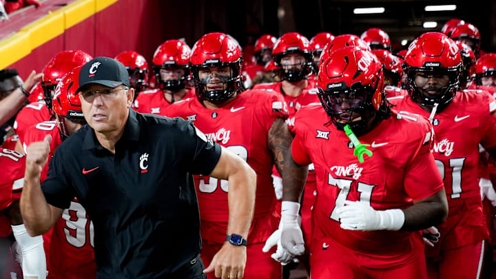 The Cincinnati Bearcats run out the tunnel to face off against the Nebraska Cornhuskers at the Kansas City Classic, Aug. 28, 2025, at Arrowhead Stadium in Kansas City, Mo.
