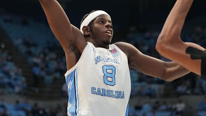 Dec 13, 2025; Chapel Hill, North Carolina, USA; North Carolina Tar Heels forward Caleb Wilson (8) shoots as USC Upstate Spartans forward Jafeth Martinez (12) defends in the second half at Dean E. Smith Center. Mandatory Credit: Bob Donnan-Imagn Images Dec 13, 2025; Chapel Hill, North Carolina, USA; North Carolina Tar Heels forward Caleb Wilson (8) shoots as USC Upstate Spartans forward Jafeth Martinez (12) defends in the second half at Dean E. Smith Center. Mandatory Credit: Bob Donnan-Imagn Images