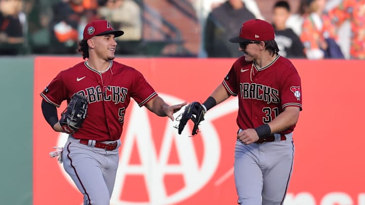 Jul 31, 2023; San Francisco, California, USA; Arizona Diamondbacks center fielder Alek Thomas (5) and Arizona Diamondbacks right fielder Jake McCarthy (31) celebrate after a play during the first inning against the San Francisco Giants at Oracle Park. Mandatory Credit: Sergio Estrada-Imagn Images Jul 31, 2023; San Francisco, California, USA; Arizona Diamondbacks center fielder Alek Thomas (5) and Arizona Diamondbacks right fielder Jake McCarthy (31) celebrate after a play during the first inning against the San Francisco Giants at Oracle Park. Mandatory Credit: Sergio Estrada-Imagn Images