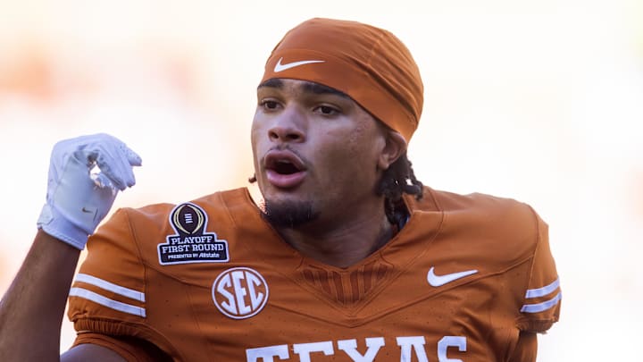 Dec 21, 2024; Austin, Texas, USA; Texas Longhorns wide receiver DeAndre Moore Jr. (0) against the Clemson Tigers during the CFP National playoff first round at Darrell K Royal-Texas Memorial Stadium. Mandatory Credit: Mark J. Rebilas-Imagn Images Dec 21, 2024; Austin, Texas, USA; Texas Longhorns wide receiver DeAndre Moore Jr. (0) against the Clemson Tigers during the CFP National playoff first round at Darrell K Royal-Texas Memorial Stadium. Mandatory Credit: Mark J. Rebilas-Imagn Images