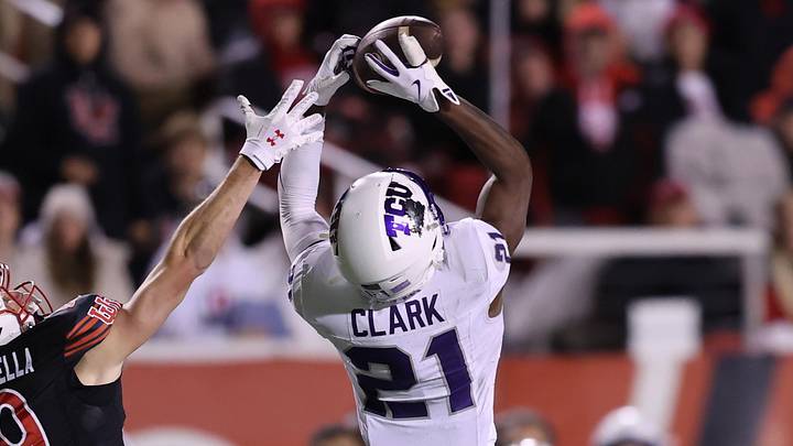 Oct 19, 2024; Salt Lake City, Utah, USA; TCU Horned Frogs safety Bud Clark (21) intercepts a pass intended for Utah Utes wide receiver Luca Caldarella (19) during the fourth quarter at Rice-Eccles Stadium. Mandatory Credit: Rob Gray-Imagn Images