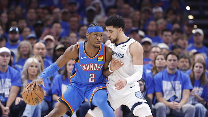 Apr 22, 2025; Oklahoma City, Oklahoma, USA; Oklahoma City Thunder guard Shai Gilgeous-Alexander (2) moves the ball against Memphis Grizzlies guard Scotty Pippen Jr. (1) in the third quarter during game two of first round for the 2024 NBA Playoffs at Paycom Center. Mandatory Credit: Alonzo Adams-Imagn Images
