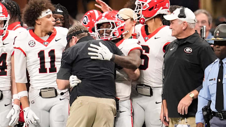 Dec 6, 2025; Atlanta, GA, USA; Georgia Bulldogs players celebrate with Georgia Bulldogs head coach Kirby Smart during the fourth quarter against the Alabama Crimson Tide  during the 2025 SEC Championship game at Mercedes-Benz Stadium. Mandatory Credit: Dale Zanine-Imagn Images