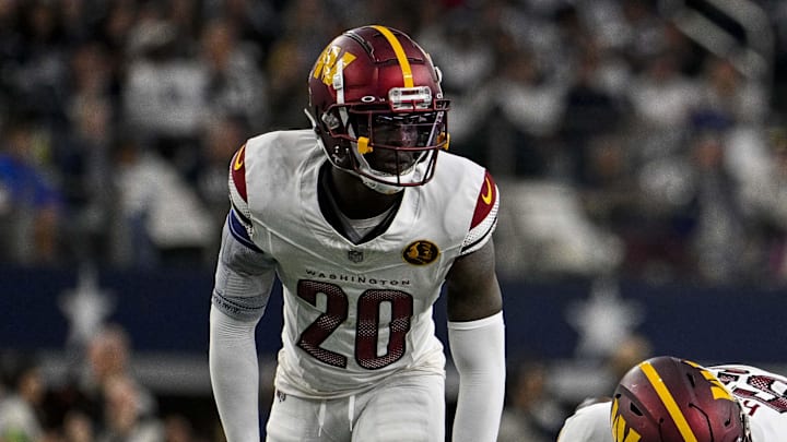 Nov 23, 2023; Arlington, Texas, USA; Washington Commanders safety Jartavius Martin (20) and defensive end KJ Henry (55) in action during the game between the Dallas Cowboys and the Washington Commanders at AT&T Stadium. Mandatory Credit: Jerome Miron-Imagn Images