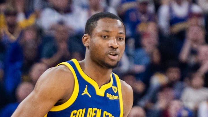 Apr 7, 2024; San Francisco, California, USA;  Golden State Warriors forward Jonathan Kuminga (00) dribles during the first quarter against the Utah Jazz at Chase Center. Mandatory Credit: Bob Kupbens-Imagn Images